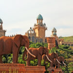 Gigantic elephant statues on Bridge of Time in famous resort Lost City in Sun City, South Africa.